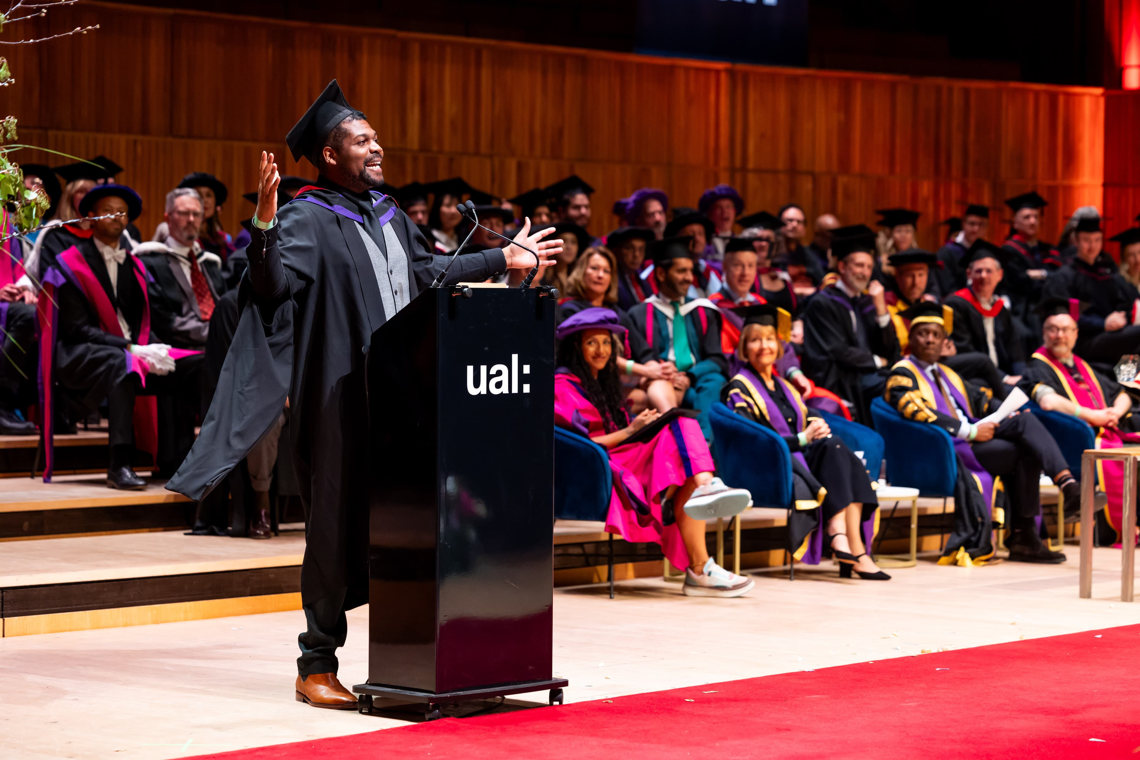 Obinna Iwuji speaking at a conference